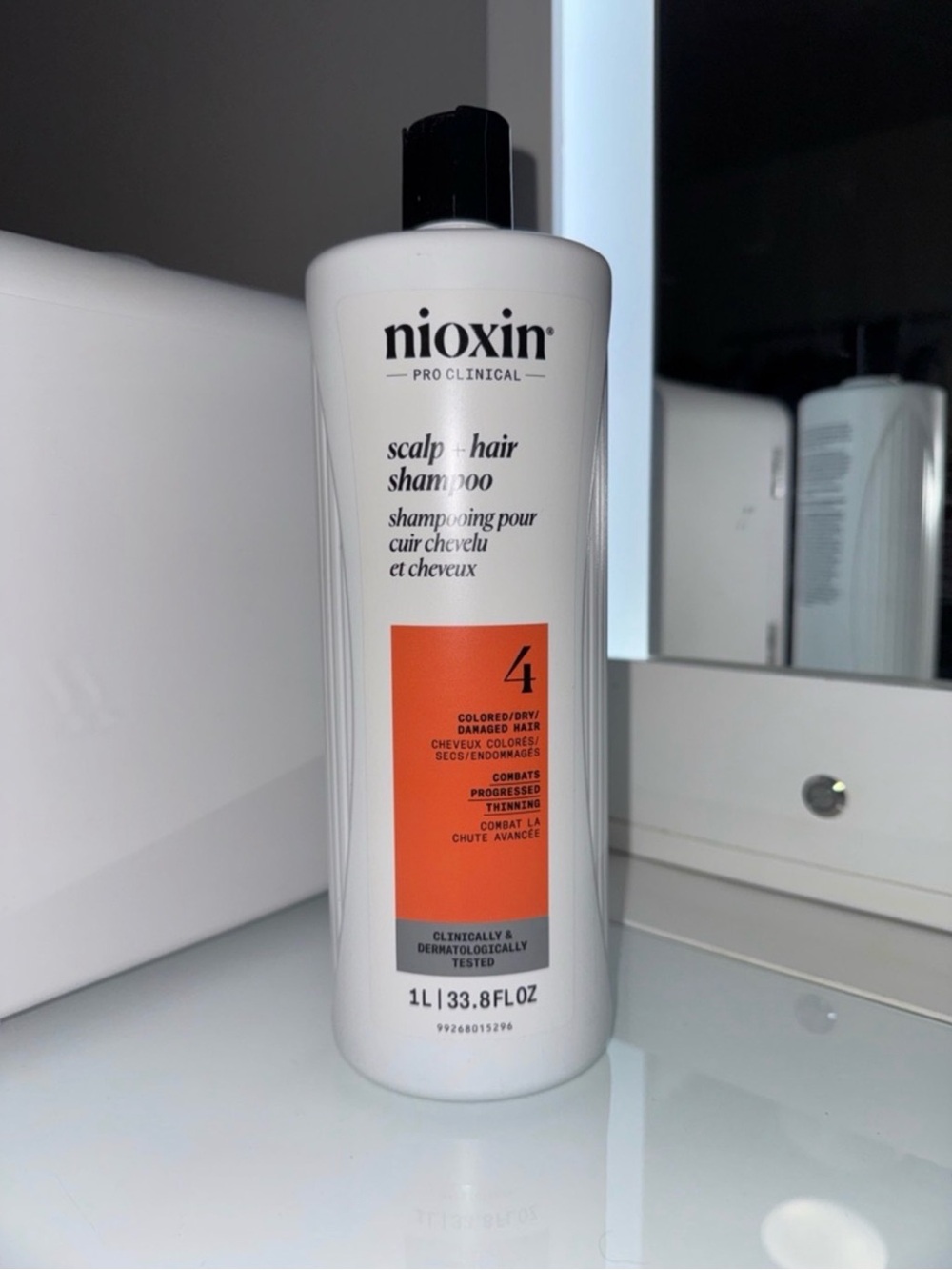 Nioxin Scalp & Hair Shampoo 4 for Colored/Dry Hair — White with Orange Label